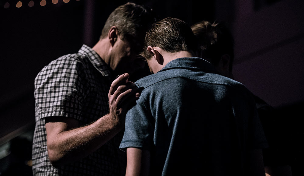 men praying